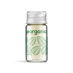 Dispensador de vidrio con seda dental vegana de hierbabuena Georganics libre de plásticos de combustibles fósiles.